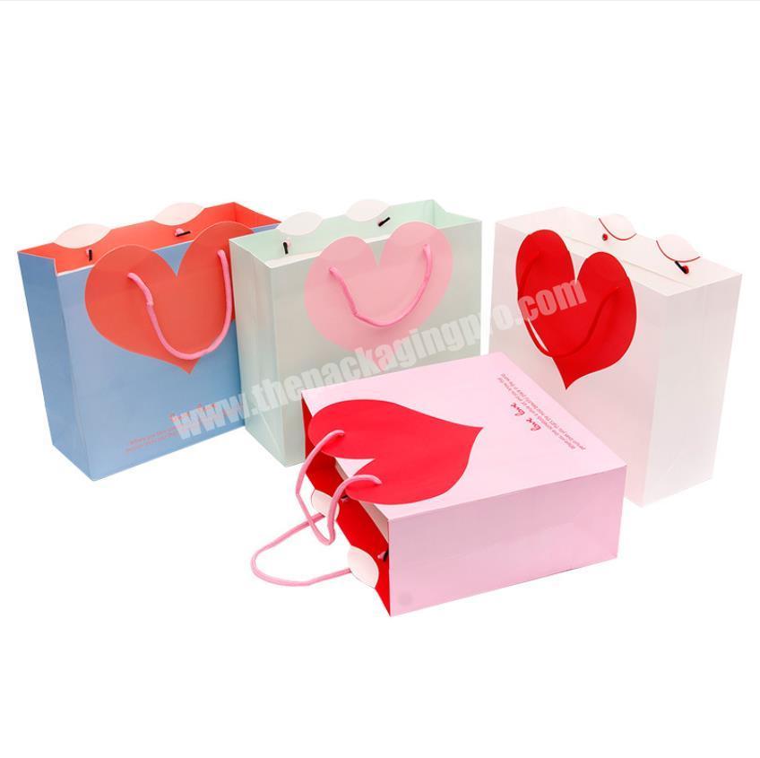 Wholesale luxury fancy cute plain paper bag with big heart shaped packaging