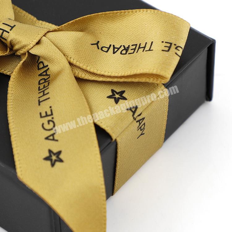 Wholesale luxury black small folding packaging custom logo magnetic paper gift box with ribbon closure manufacturer