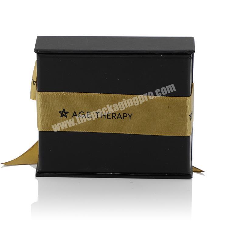 Wholesale luxury black small folding packaging custom logo magnetic paper gift box with ribbon closure wholesaler