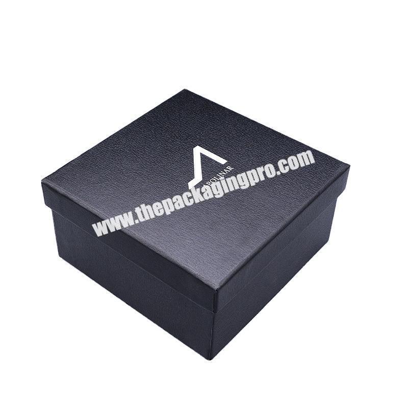 black cardboard with white logo packaging box