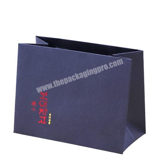 China Factory Art paper packaging bag with logo embossing and double sides printing