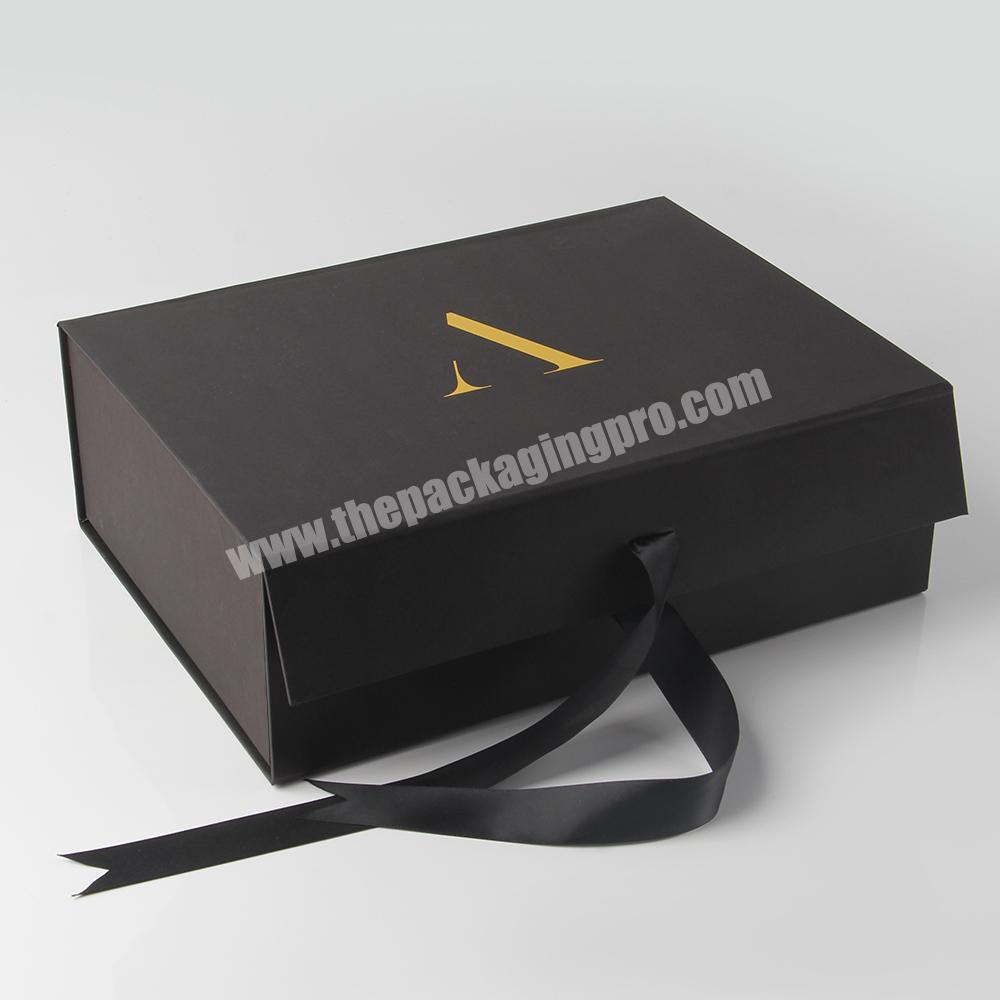 China hot sale packaging magnetic ribbon book shaped paper gift box
