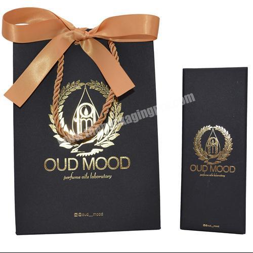 China Manufacturer Wedding Favor Luxury Paper Bag Personal Logo Hot Stamping Packaging Black Candy Craft Paper Gift Bag With Bow