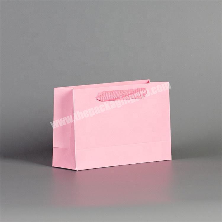 China supplier OEM pink custom logo paper gift bag for baby wear