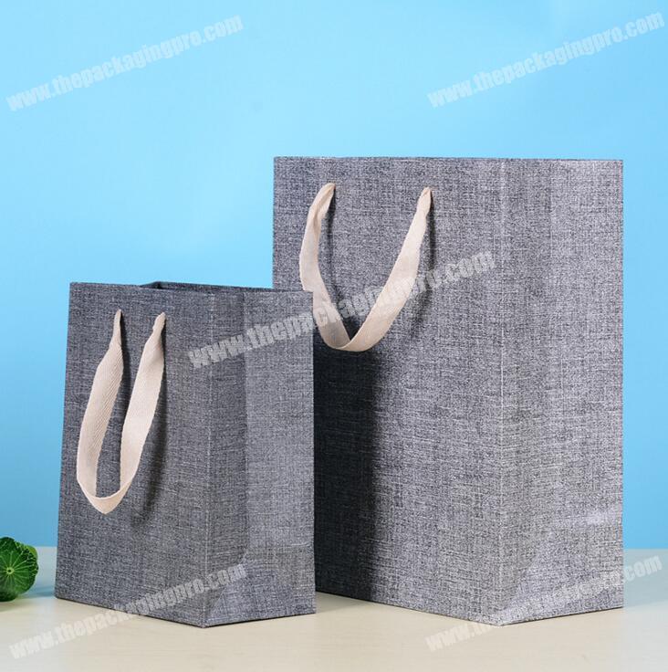 Chinese wholesale cheap waterproof paper bag,handle paper bag,logo paper bag
