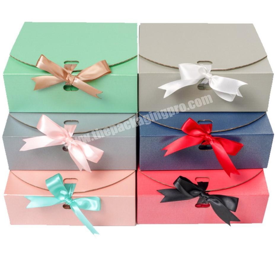 collapsible and foldable quick dispatch corrugated paper box with ribbon