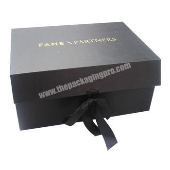 Custom black ribbon closure cardboard gift packaging box design with gold stamping logo