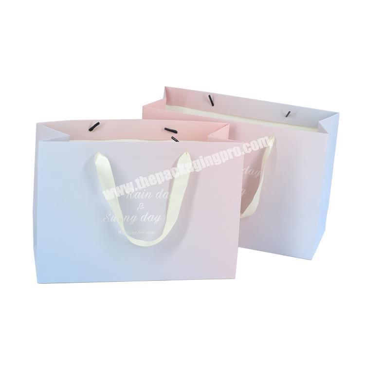 Custom CMYK matt embossed pink cardboard paper bag for gift