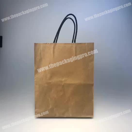 Custom high quality new design slogan brown kraft paper bag with your own logo