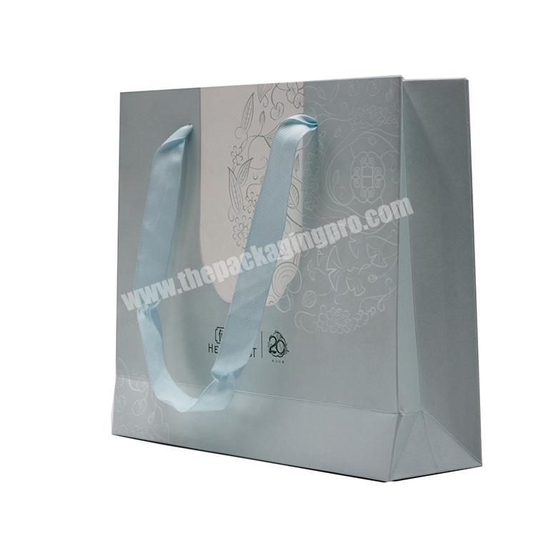 Custom logo blue cardboard paper bag for shopping with handle