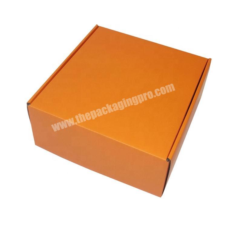 custom orange mailer box, pink colored corrugated box; black printed shipping carton box; white postage box