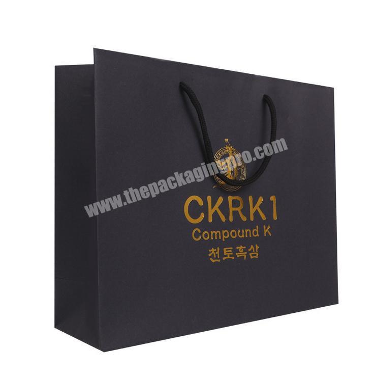 Custom printed recycled Black shopping paper bag wholesale Black kraft Paper gift bag with logo for packaging