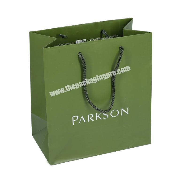 Custom printing green wholesale paper bags for cosmetic store gift packaging