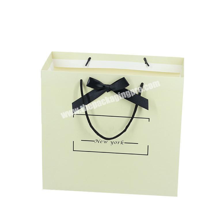 Custom recyclable CMYK printing gift paper bag with custom logo with bowknot