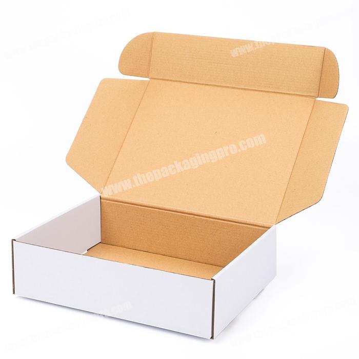 https://thepackagingpro.com/media/goods/images/custom-white-brown-kraft-e-commerce-subscription-packaging-belt-roll-end-front-tuck-mailer-box-with-dust-flaps.jpg