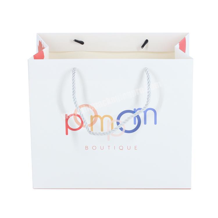 Customized logo recyclable packing CMYK boutique paper carry bag for packaging