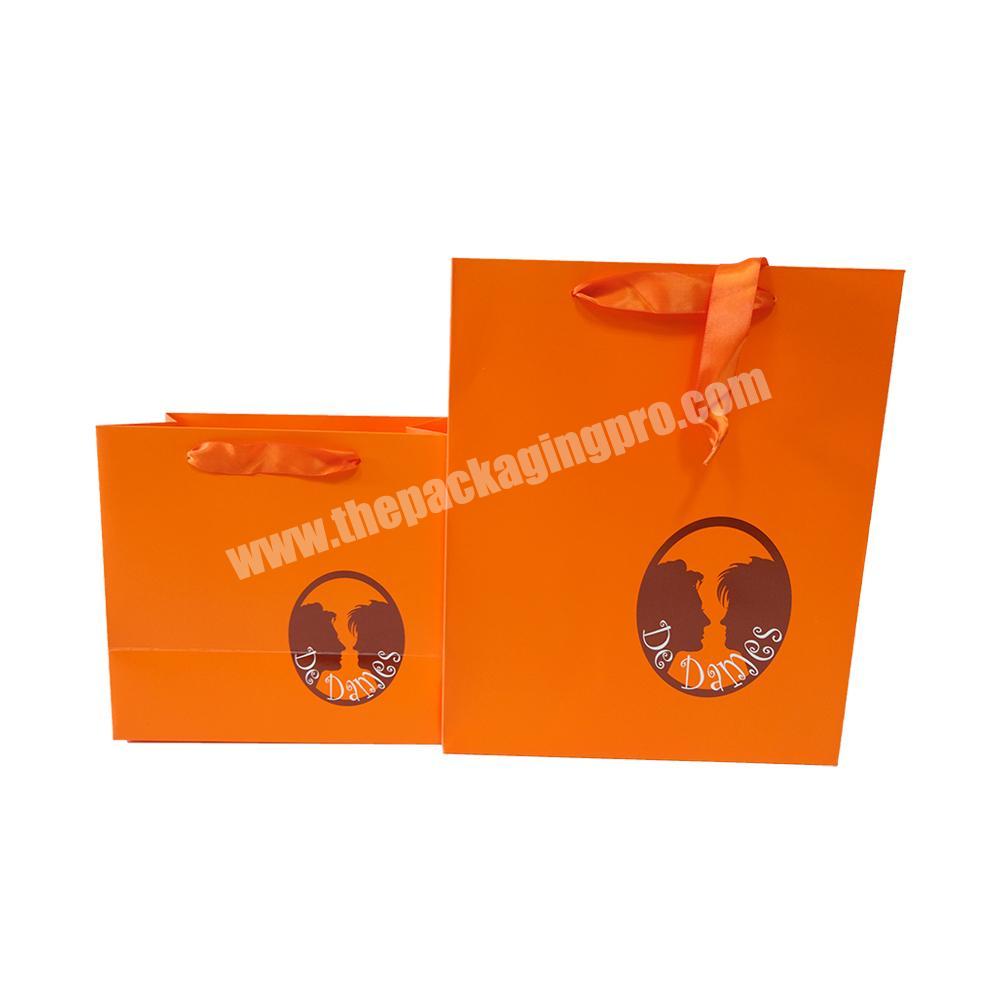 customized orange gift paper bag with ribbon handle