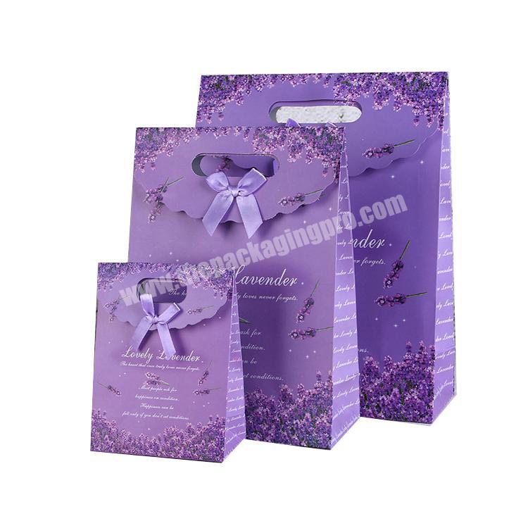 Customized purple paper bag with bow tie ribbon