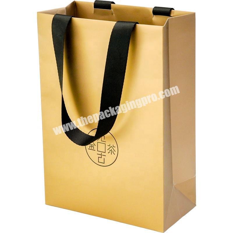 Dongming customized high quality tea white cardboard paperbag with hot stamping