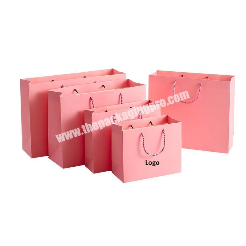 Eco friendly recyclable customized packaging bags pink cardboard paper shopping gift wedding tote bags with cheap price