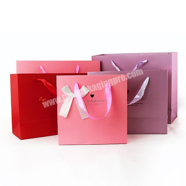 Elegant decorated ribbon and  bowknot factory supply package paper gift bag
