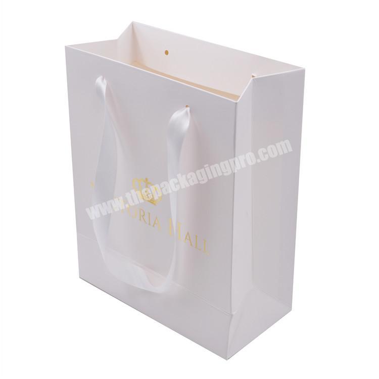 Factory supplier hot sales print white kraft paper in stock  gold hot stamping  shopping paper bag with ribbon handle