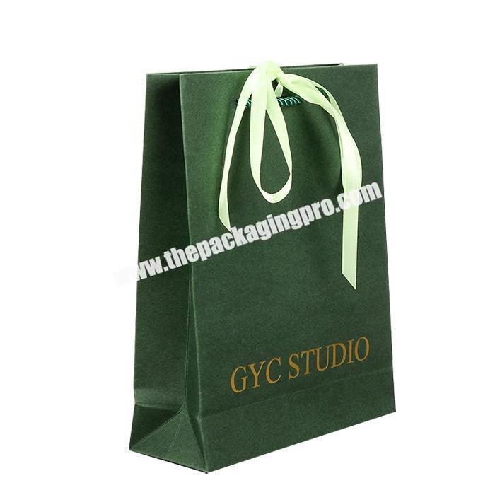 Fancy paper gift packaging shopping bag with ribbon bow tie