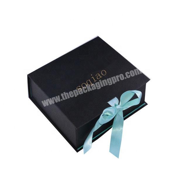 folded gift box with ribbon closure