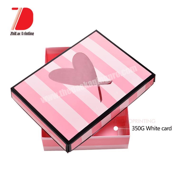 Handmade folding paper packaging boxes with cut out heart shape window