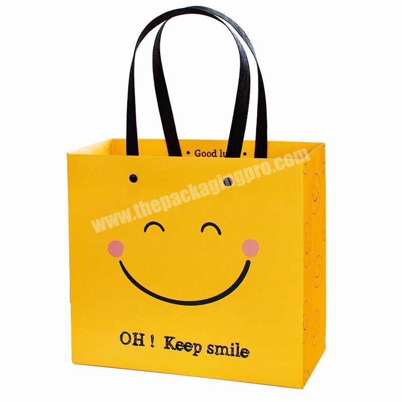 Hot Sale High Quality Recycle Popular  Yellow Color Smiling Face Printed Portable Gift Packaging Bag