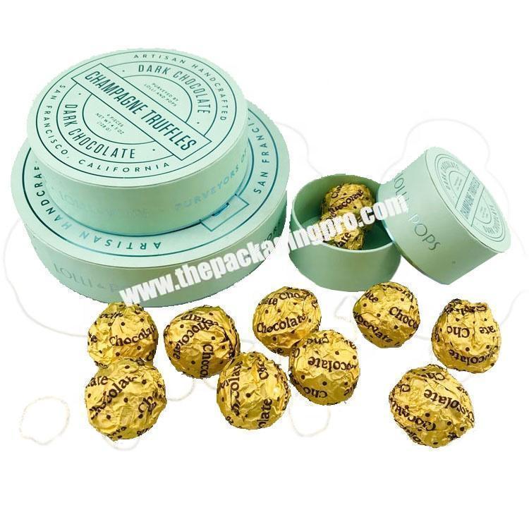 lid and base round shape dark chocolate paper gift box  sweets packaging with colored foil pattern