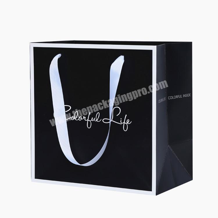 Low cost recyclable feature ribbon handle packing shopping gift packaging paper bag for gift Shoes clothes T-shirt