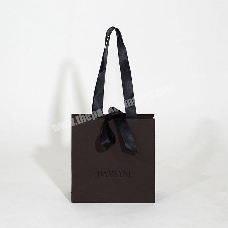 Luxurious paper black gift bags shopping black bag packaging with ribbon