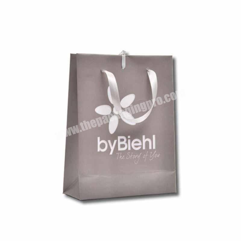 Luxury design clothing packaging paper bags for sale