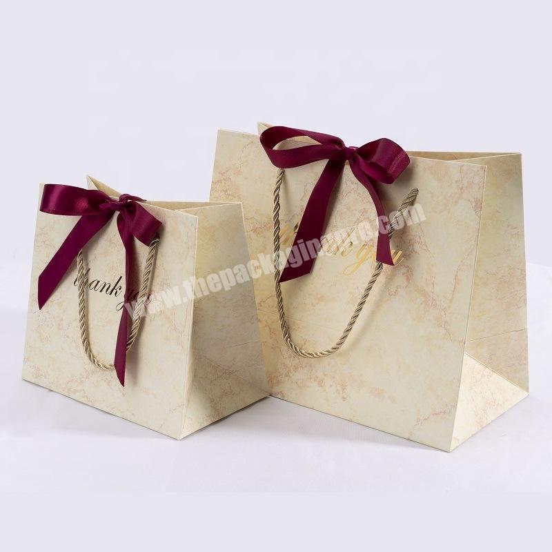 Luxury gold foil print shopping tote 250gsm paper bag with bowknot