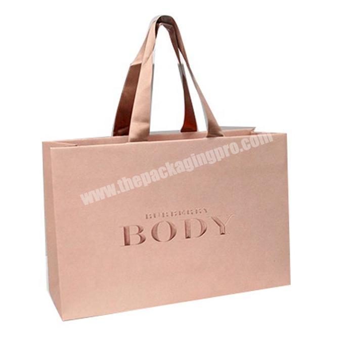 Luxury paper shopping bag with rope handle for retail store