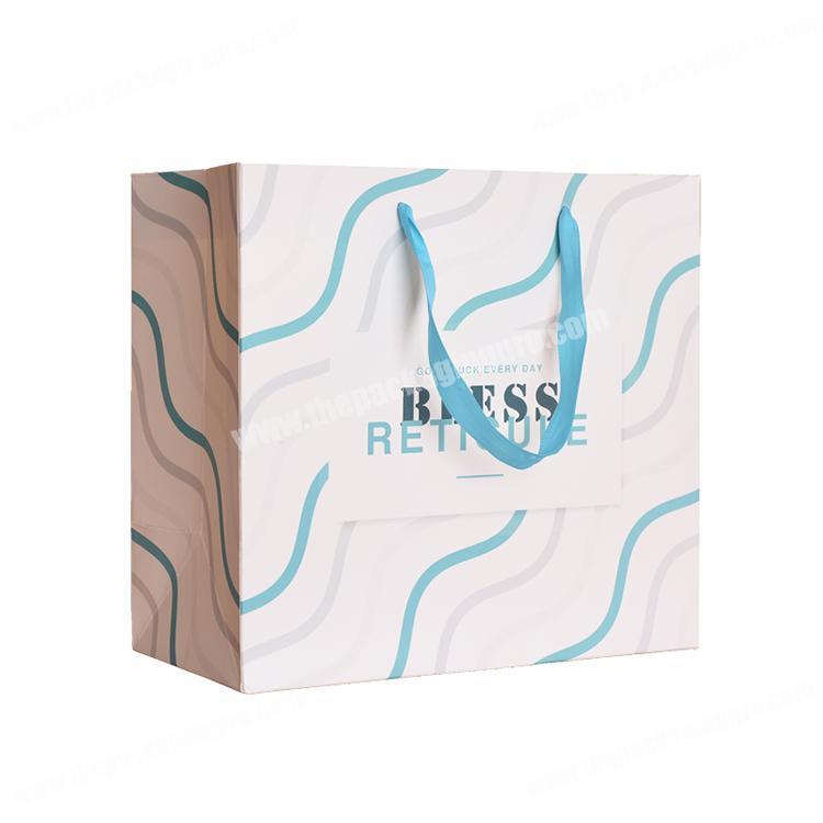 New Design high quality strong coated paper clothes packaging bag