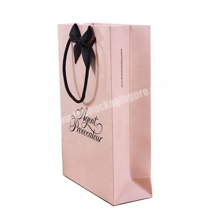 New design wholesale low cost recycled pink paper bag with ribbon tie
