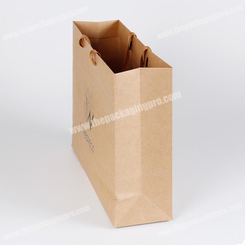 Paper shopping bag for clothes with twisted handle