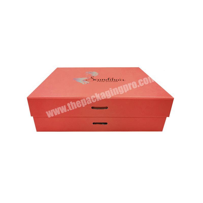 Pink background ribbon decorated cardboard boxes for gift
