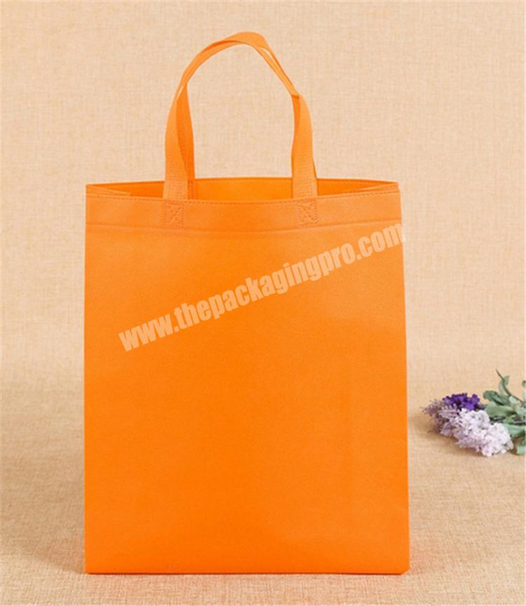 Promotional cheap quality orange non woven shopping bag for market