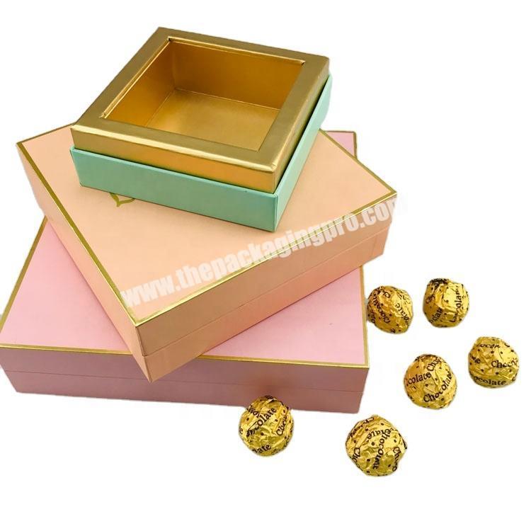 rigid paper rectangle chocolate gift packaging with gold foil pattern and gold inside with lift off lid