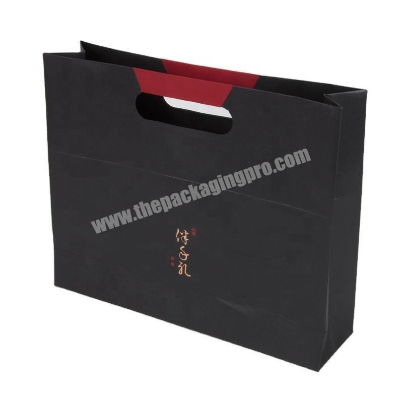 SC Top quality black paper gift packaging bag with die-cutting handle