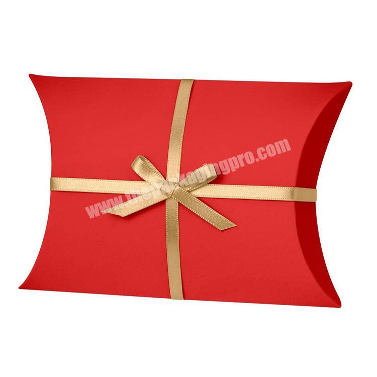 Small craft paper pillow gift box with ribbon