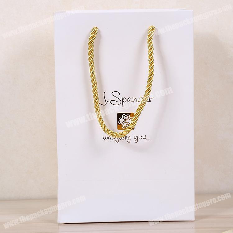 Versatile custom luxury gold rope handle paper bag gift garment shopping bag