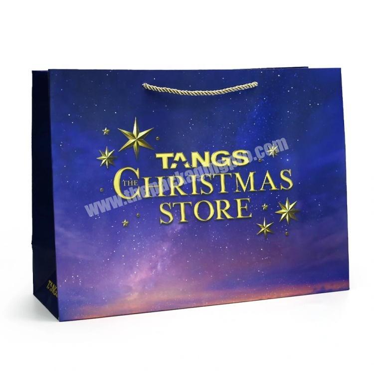 White Paperboard Material PP Rope Purple Christmas Store Gift Paper Bags With Logo Printing