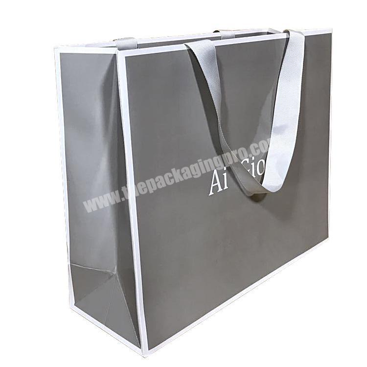 Wholesale customize logo and size Gray Color Paper Thickness 250gsm Jewelry Shopping Bag With Ribbon Rope Custom Gift Bag
