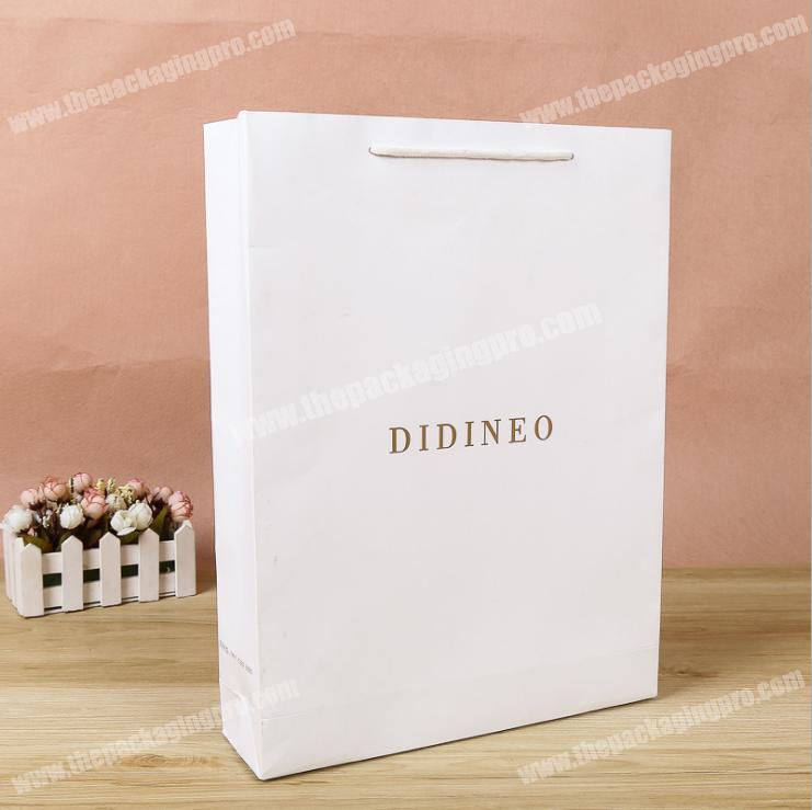wholesale fancy luxury paper bag closed with handle