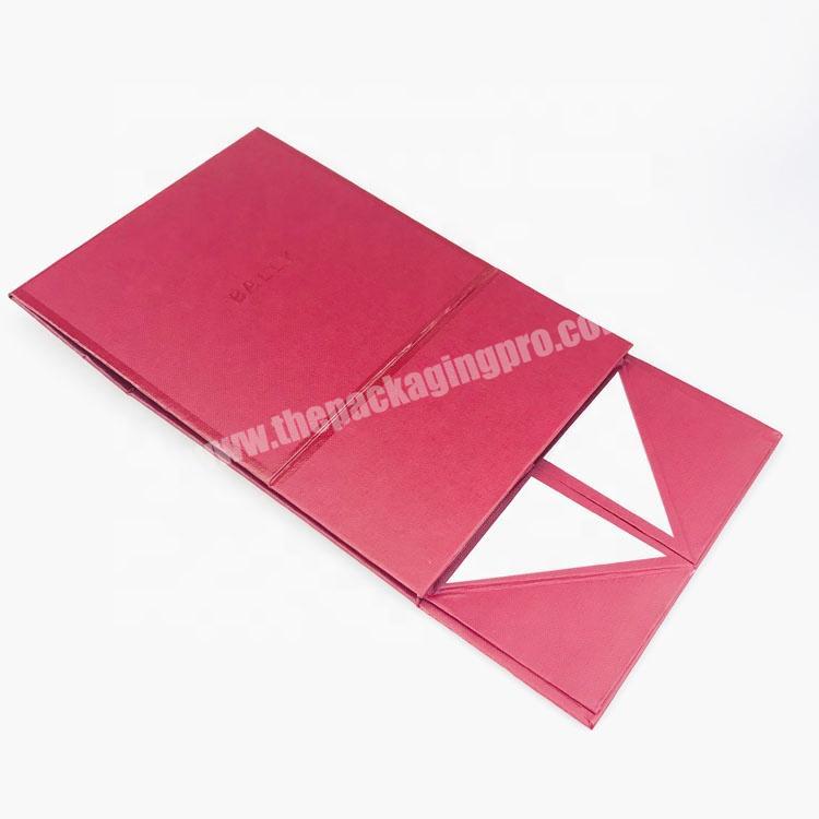 Wholesale red color cardboard fancy paper embossing pattern magnetic foldable box with Spot UV coating and heat wrapping
