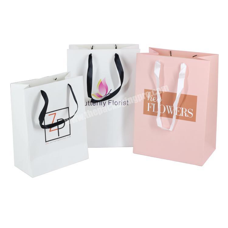 Wholesale White 350gsm shopping printed paper gift custom logo paper bag with ribbon